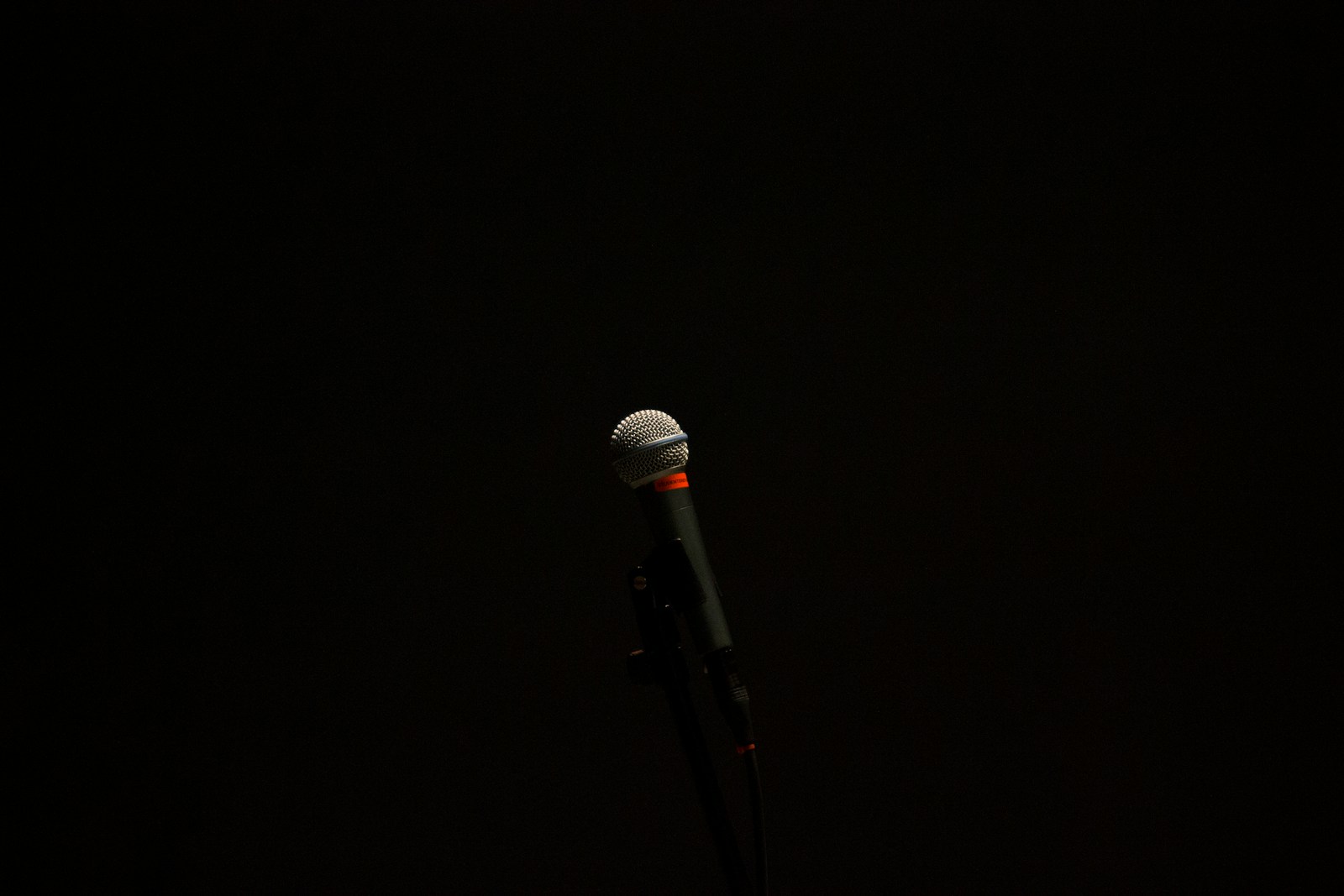 black corded microphone with stand