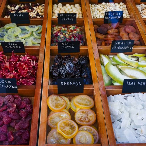 a display case filled with lots of different types of fruits